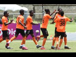 Ian Allen 
Members of Tivoli Gardens' Jamaica Premier League team celebrate a goal against Vere United during a recent match at the UWI-JFF Captain Horace Burrell Centre of Excellence.