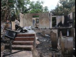 These houses were set ablaze in Granville, St. James, by hoodlums.