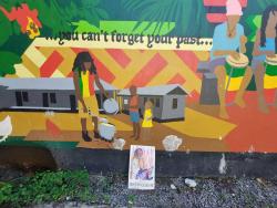 A mural of Georgie sharing out some of his popular dish is prominent in Culture Yard.