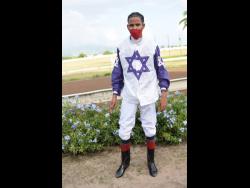 Raddesh Roman in the winners’ enclosure after riding EL GRINGO to victory at Caymanas Park on Sunday, November 7.