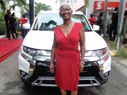 Daphne Francis poses in front of her 2021 Mitsubishi Outlander.