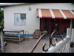 The yard in which Sorika Picart, a 16-year-old student of the Alpha Academy, was shot and killed, allegedly by her granduncle, on Saturday.