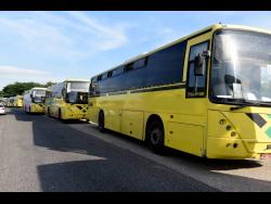 Jamaica Urban Transit Company buses parked outside the company’s Portmore, St Catherine depot as drivers protested against what they consider the unfair treatment of their colleague by cops.