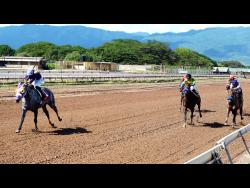 DUKE (left), ridden by Robert Halledeen, wins The Port Royal Sprint ahead of FATHER PATRICK over six furlongs at Caymanas Park in St Catherine on Saturday, November 13.