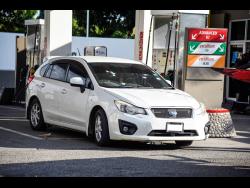 The car in which two men were killed at a Red Hills Road gas station last Monday.