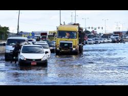 Motorists stuck in traffic along a section of Marcus Garvey Drive in the vicinity of the Tinson Pen Aerodrome that was flooded after afternoon showers.