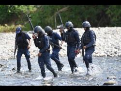 Policemen on the hunt for Davian Bryan in October.