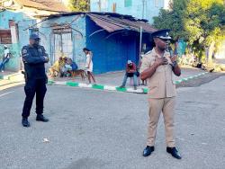  Superintendent Berrisford Williams (left), head of the Kingston Central Police Division, addresses the peace meeting while Senior Superintendent Stephen McGregor, head of the Area Four police looks on. 