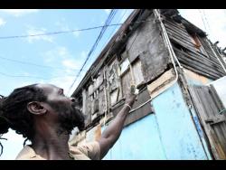 A two-storey board house in Denham Town, Kingston. The census will look at areas such the housing stock to see how Jamaicans are living.