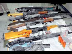 A stash of illegal firearms, magazines and ammunition that were intercepted by the police.