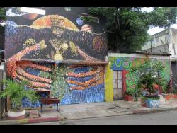 Murals at the front of Life Yard on Fleet Street in central Kingston.