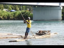Donald Richards manoeuvres his raft on the Rio Grande in Portland.