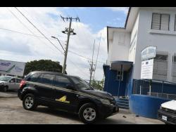 Independent Commission of Investigations personnel waiting at the Denham Town Police Station before heading to the crime scene.