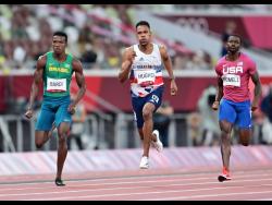 Great Britain’s Zharnel Hughes (centre) competes with USA’s Trayvon Bromell (right) and Brazil’s Felipe Bardi in heats of the Men’s 100m event at the Olympic Games in Tokyo, Japan, on Saturday, July 31, 2021.