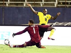 Reggae Boy Michail Antonio (right) makes a run at goal against United States goalkeeper Zack Steffen during a World Cup qualifier at the National Stadium in Kingston on Tuesday, November 16, 2021.