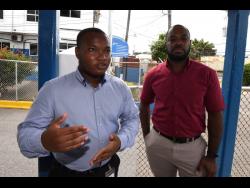 Jordan Grindley (left) is happy that he was able to return a wallet belonging to Andrei Ottey (right), which he found last Wednesday. The wallet contained more than  $50,000 in cash. 
