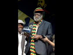 Junior Byles receiving a Lifetime Achievement Award in 2019 at a benefit concert held for him.