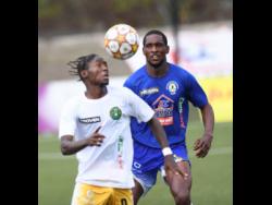 Vere United’s Ricardo Messam heads the ball while being closely watched by Mount Pleasant United’s Liston James, during the Jamaica Premier League football encounter at the UWI-JFF Captain Horace Burrell Centre of Excellence on Monday, January 1. 