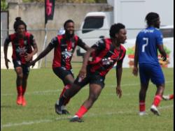 Arnett Gardens goalscorer Luca Kong (second right) runs away from his teammates after opening the scoring against Dunbeholden in their Jamaica Premier League match at the Drax Hall Sports Complex in St Ann on Monday.