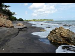 The black sand and crystal-clear waters at Farquahar Beach in Clarendon are eye-catching. 