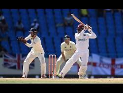 West Indies batsman Nkrumah Bonner (right) plays a shot on his way to his century during their first Test cricket match against England, at the Sir Vivian Richards Stadium in North Sound, Antigua and Barbuda, on Thursday.
