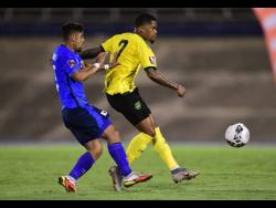 Credit: Gladstone Taylor Jamaica’s Leon Bailey (right) makes a pass ahead of El Salvador’s Jairo Henríquez during their Concacaf World Cup qualifier at the National Stadium in Kingston on Thursday night.