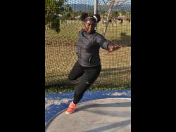 Cedricka Williams goes through her routine in the discus ring during a training session at G.C. Foster College in St Catherine on Tuesday.