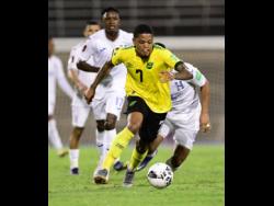 Jamaica’s Leon Bailey in action against Honduras during their FIFA World Cup qualifying football match at the National Stadium on Wednesday night.