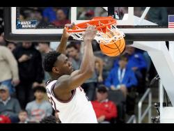 Illinois’ Jamaican basketballer Kofi Cockburn dunks against Chattanooga during the first half of a college basketball game in the first round of the NCAA tournament in Pittsburgh, Pennsylvania on Friday, March 18.