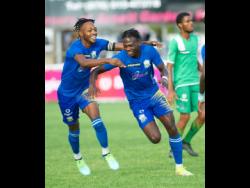 Molynes United’s Nicholas Nelson (left) and Jahiem Harris.
