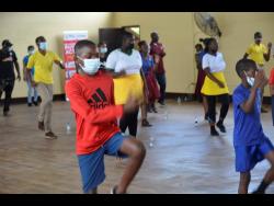 Students of Ferncourt High School in St Ann engage in a physical workout during National School Moves Day activities at the institution on Friday.