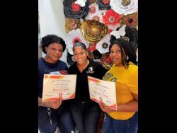 Dancer-turned-hairstylist and salon owner Sher Luxury Doll (centre) stands with two of the participants, Shantel and Taniesha Clunis, who successfully completed the recent Lace Meltdown workshop.