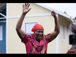 Irene Morgan of Corn Hill, Smithville in Clarendon, gives thanks for her two-bedroom house provided by Food For The Poor.