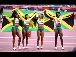 Jamaica’s women’s 4x100m relay team of (from left) Elaine Thompson Herah, Shelly-Ann Fraser-Pryce, Briana Williams, and Shericka Jackson celebrate gold at the Tokyo 2020 Olympics Games at the Tokyo Olympic Stadium in Japan on Friday, August 6, 2021. 