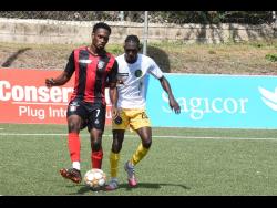 Renaldo Cephas (left) of Arnett Gardens is challenged by Vere United’s Trevance Salmon during a Jamaica Premier League game at the UWI-JFF Captain Horace Burrell Centre of Excellence in St Andrew on Monday, February 14.