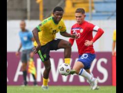  Malachi Douglas of Jamaica drives the ball forward during the 2022 Concacaf Under-20 Championship match against Costa Rica at the Francisco Morazán stadium in San Pedro Sula, Honduras last Saturday. The game ended in a 1-1 draw.