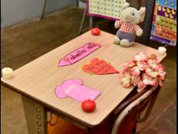 The desk and chalkboard in one of the infant classes at Beulah All Age School, where five-year-old Rafaella Smith and her 12-year-old sister Sharalee Smith attended were decorated with hearts and teddy bears in their honour.