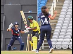 Jamaica Under-19 opener Tasha Gaye Gordon is bowled by  Snigdha Paul (right) of the United States during their Cricket West Indies Women’s Rising Stars Championship match at the Brian Lara Cricket Academy in Trinidad and  Tobago yesterday. Captain and wicket-keeper Geetika Kodali looks on.