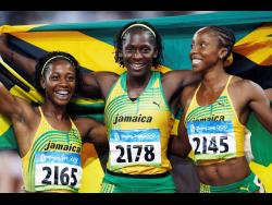 Jamaica’s gold medal winner (from left) Shelly-Ann Fraser and silver medal winners Kerron Stewart and Sherone Simpson celebrate after the women’s 100-metre final at the Beijing Olympic Stadium, Beijing, China, in 2008.