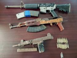 Photos of the three illegal weapons and ammunition seized in St James.