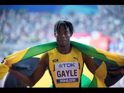 Tajay Gayle celebrates winning the the men’s long jump finals with a jump of 8.96 metres at the 2019 IAAF World
Athletic Championships
in Doha, Qatar.