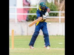 Man-of-the-match Dennis Bulli, of the Jamaica Defence Force, plays a shot on the way to his top score of 35 against St Mary in the Jamaica Cricket Association 50-over final at Sabina Park in Kingston on Saturday.