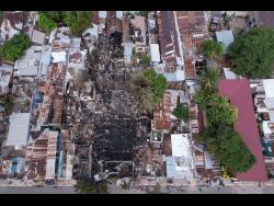 left: An aerial view of the damage to the homes.