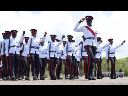 Newly minted police officers from Batch 136 march during their Passing Out Parade at the National Police College of Jamaica, Twickenham Park, St Catherine on Thursday.