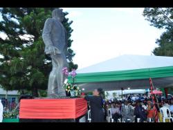 Minister of Culture, Gender, Entertainment and Sport, Olivia Grange, lays a floral tribute at the life-sized statue of National Hero Marcus Garvey, during a civic ceremony to mark the 135th anniversary of his birth, held at Lawrence Park, St Ann’s Bay, St Ann, on Wednesday.
 

 