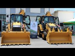 The two four-wheel drive CAT 426F2 backhoes which were presented to the Rural Agricultural Development Authority on Wednesday, during a handover cerrmony at the Agro Investment Corporation head office at 188 Spanish Town Road, Kingston.