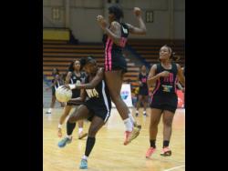 Wing attack Khadijah Williams of Manchester Spurs drives with the ball ahead of an aerial Abbeygail Linton of Kingston Hummingbirds during an Elite League match at the National Indoor Sports Centre in 2019, the last time the competition was played.
