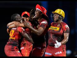 Jamaica’s Natasha McLean (right) celebrates victory with (from left) Kyshona Knight, Anisa Mohammed and Lee-Ann Kirby as the Trinbago Knight Riders won the inaugural Hero Caribbean Premier League Women’s title on Sunday.