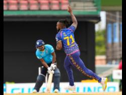 Kyle Mayers (right) of Barbados Royals celebrates the dismissal of Johnson Charles of Saint Lucia Kings during their Caribbean Premier League (CPL) match at Warner Park Sporting Complex yesterday in Basseterre, Saint Kitts and Nevis. Royals won the match by 11 runs.