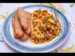 The finished product, ackee and jerk pork with coconut festivals.